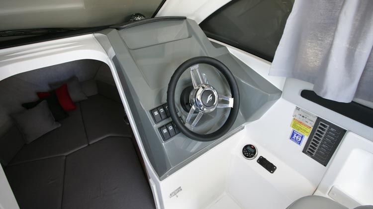 Marine grade electrical switches, compass, media/receiver, USB and 12V sockets and Karnic Deluxe steering wheel